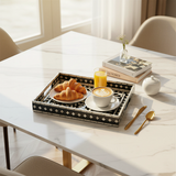 mosaic tray with breakfast on marble table