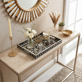 mosaic tray with candle and vase on console