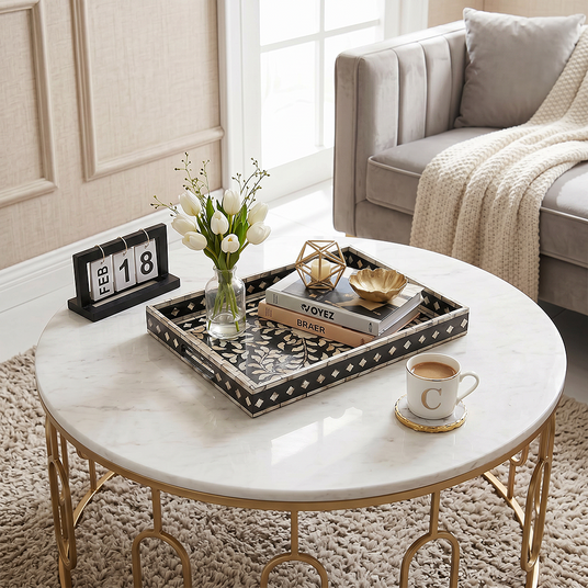 mosaic tray with flowers and books on coffee table