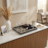 mosaic tray with wine and grapes on sideboard
