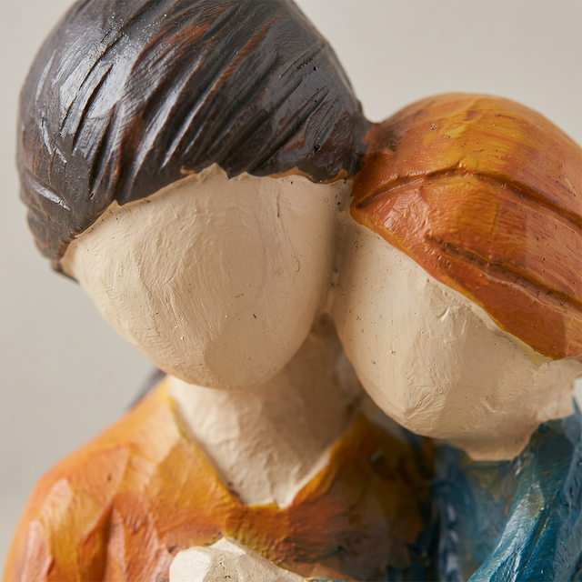 mother child figurine face detail closeup
