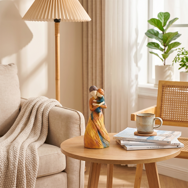 mother child figurine on coffee table with books