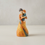 mother child figurine on white background