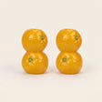 orange candle holder pair on white background