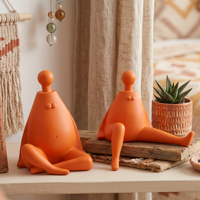 orange figurines on wooden surface