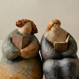 pair of pebble figurines close up