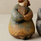 pebble figurine body side close up