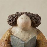 pebble figurine with hair close up