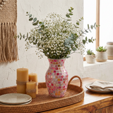 pink mosaic vase with babys breath on tray