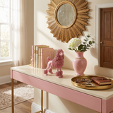 pink poodle on console table with flowers