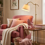 pink poodle on side table in reading nook