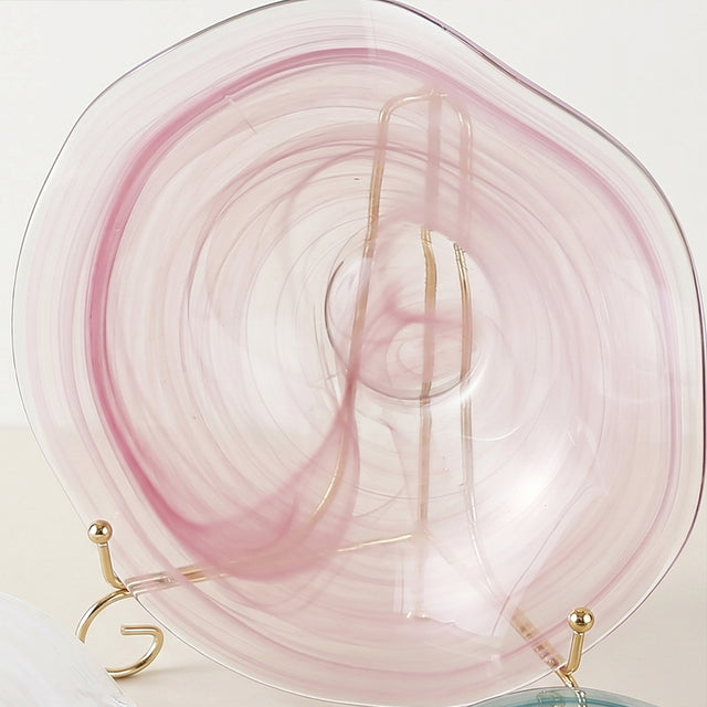 pink round glass decorative plate front view on standbac