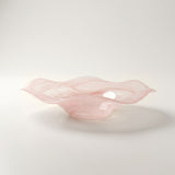 pink wavy glass bowl side view close up