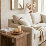 rattan tray with candles on wooden side table