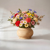 round wooden vase with colorful daisies