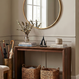 sailboat sculpture on console table with mirror
