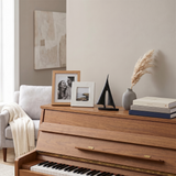 sailboat sculpture on wooden cabinet