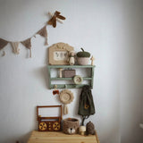 scandinavian pinecone wall decor hang on white wall