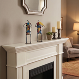 sculptures on fireplace mantel warm living room