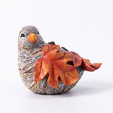 single autumn leaf bird sculpture side view