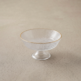 small glass bowl on beige surface