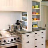 stainless steel mechanical apple baking cooking kitchen timer beside the kitchenware