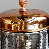 stainless steel sealed coffee storage canister with a pineapple handle details