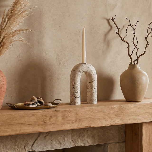 stone arch candle holder on rustic mantel