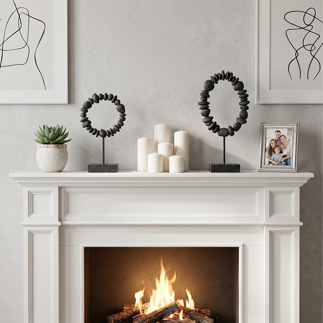 stone ring sculptures on white mantel