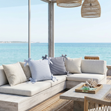 striped bow pillows on beachfront patio sectional