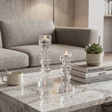 tall and short crystal candle holders on coffee table