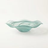 teal wavy glass bowl side view close up