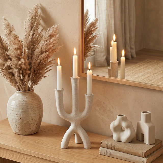 textured candle holder with pampas on wooden console