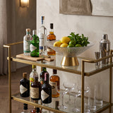 textured glass gold base fruit bowl with fruits on bar cart