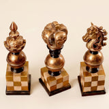 three chess piece decorations standing together