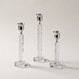 three crystal and silver candle holders