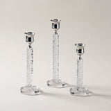 three crystal and silver candle holders