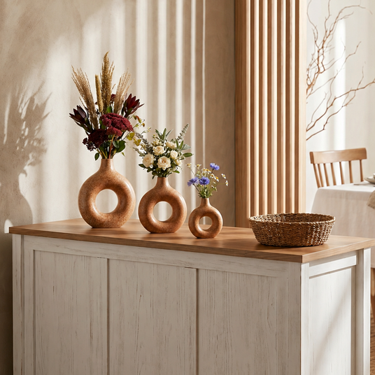 three donut vases on wooden sideboard