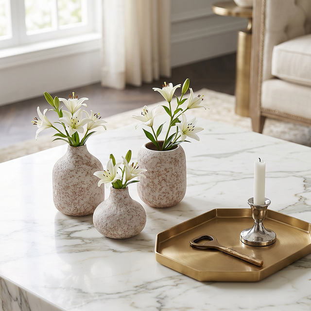 three small vases on marble table