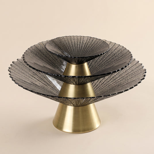 three stacked black bowls