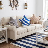 three starfish pillows on cream sofa