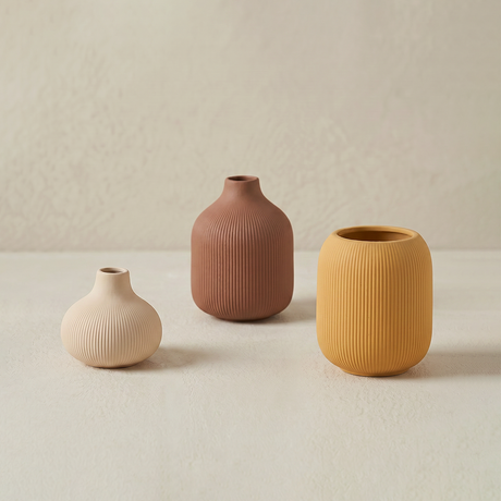 three textured vases on background