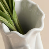 top view of white hand vase floral opening
