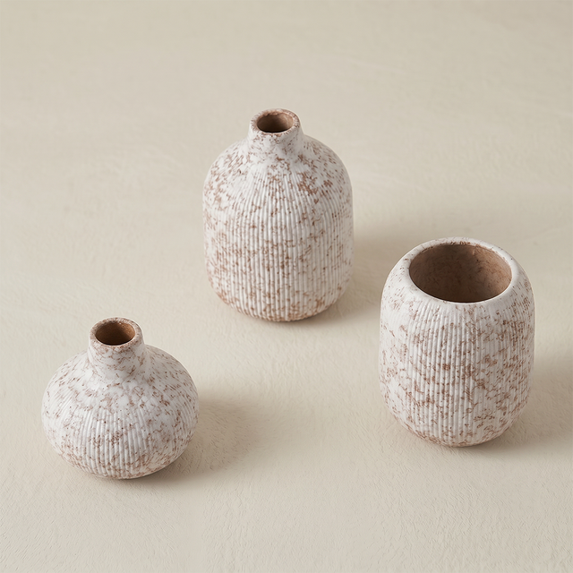 two textured vases on background