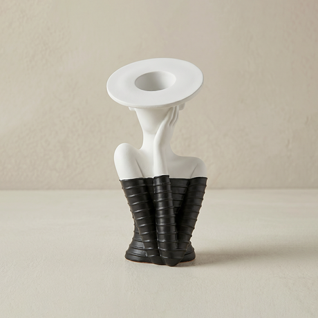 vase female torso black sleeves white background