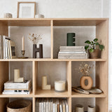 vase in white bookcase grid
