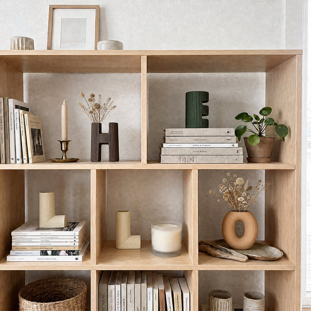 vase in white bookcase grid