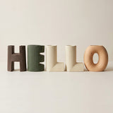 vase with hello wooden letters