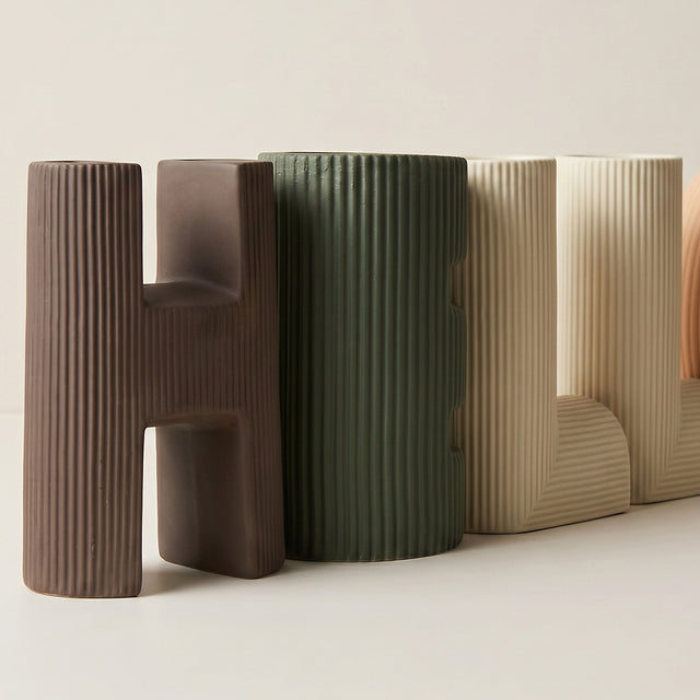 vase with wooden block letters