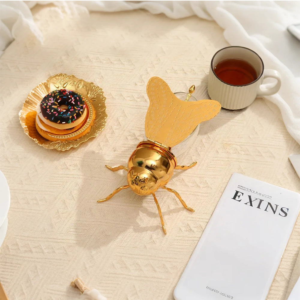 vintage bee themed honey jar with spoon decorative piece on the table